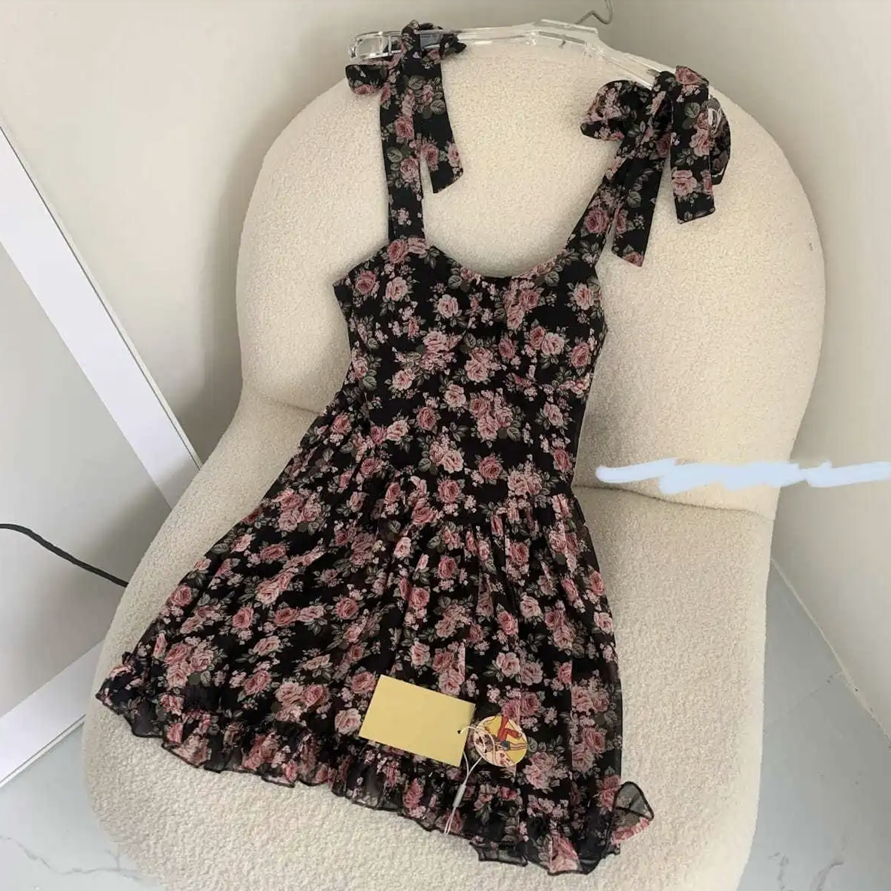 Before: dress with label lying on chair